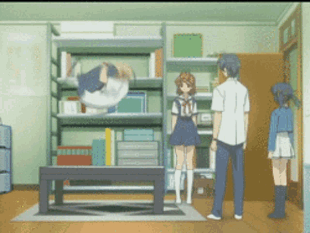 a man and two girls are standing in a room with shelves and boxes