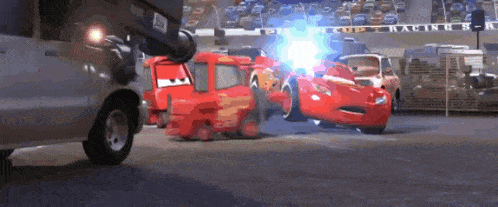 a group of cars are racing on a race track with a sign that says cup racing on it