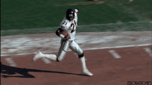 a football player with the number 21 on his jersey is running on the field