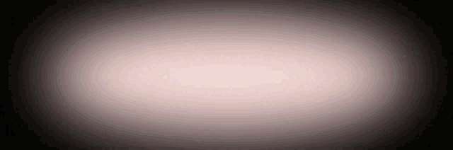 a white circle on a black background with a glowing center .