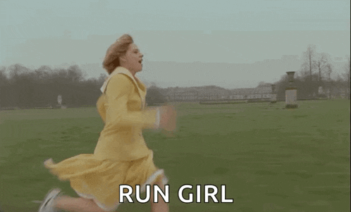 a woman in a yellow dress is running in a field with the words `` run girl '' .
