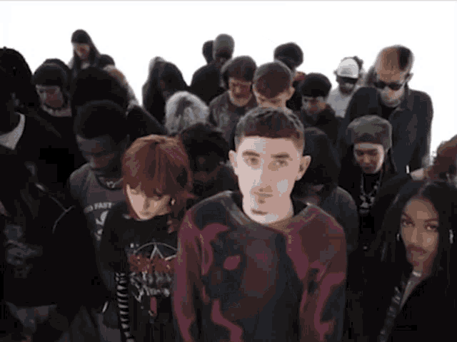 a group of people standing in a line with one wearing a shirt that says no fast
