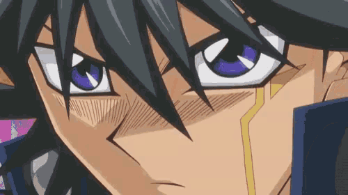 a close up of a person 's face with a purple eye