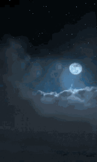 a full moon shines through the clouds in a dark night sky