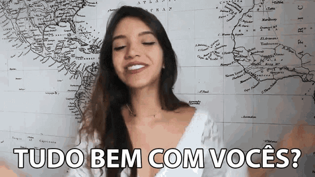 a woman stands in front of a map with the words tudo bem com voces written on it