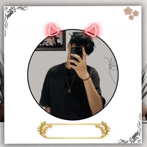a man taking a picture of himself in a circle with devil horns on his head
