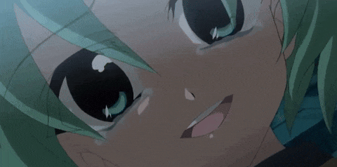 a close up of a girl 's face with green hair