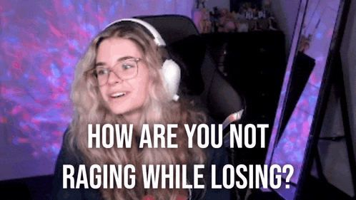 a woman wearing headphones and glasses is sitting in a chair in front of a computer .
