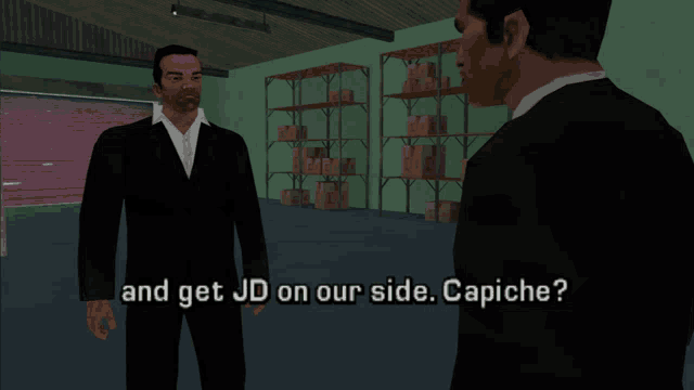 two men are standing in a warehouse and one of them says " and get jd on our side "