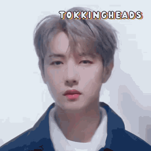 a close up of a young man 's face with the words tokingheads above it