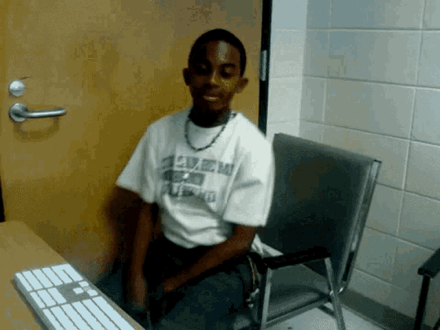 a young man wearing a t-shirt that says u.s. army on it