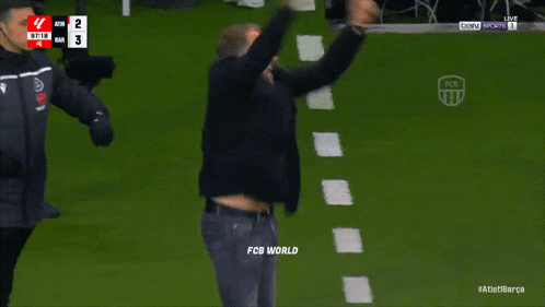 fcb world is displayed on the screen of a soccer match