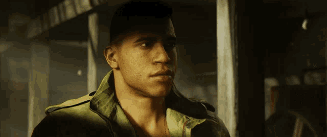 a close up of a man 's face with a green jacket on