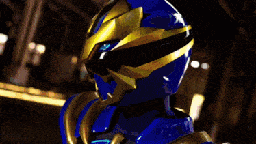 a blurred image of a blue and gold costume