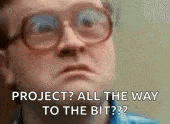a man wearing glasses is saying `` project ? all the way to the bit ? '' .