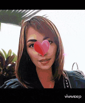 a woman with a heart on her nose and the word vivavideo below her