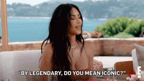 a woman sitting at a table says " by legendary do you mean iconic ? "
