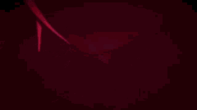 a girl with red hair is standing in front of a red moon in a video game .