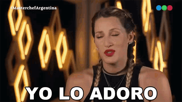 a woman says yo lo adoro in front of lights
