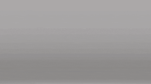 a gold statue of a fist on a white background