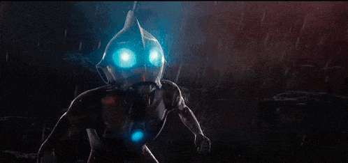 a robot with glowing blue eyes is holding a gun