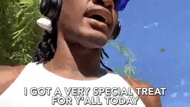 snoop dogg is wearing headphones and sunglasses and says i got a very special treat for y'all today .