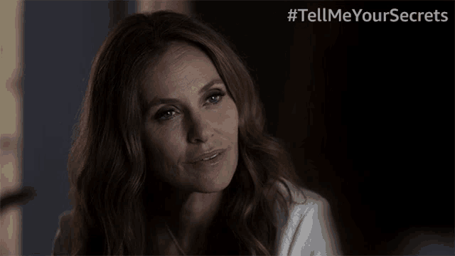 a woman in a white shirt is asking what
