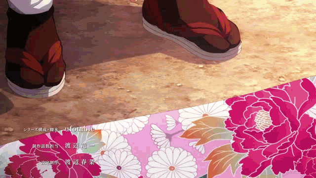 a close up of a person 's feet on a pink and white floral background