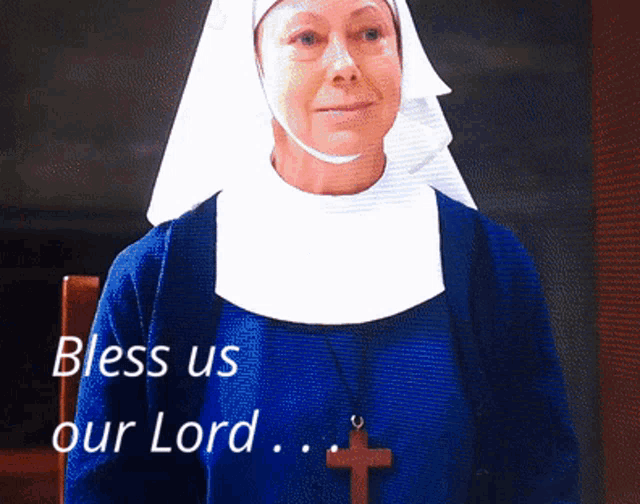 a nun says " bless us our lord " in front of a cross