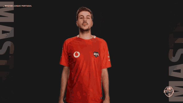 a man wearing a red shirt that says master league portugal on it