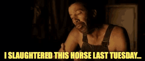 a man in overalls is eating a piece of meat and says `` i slaughtered this horse last tuesday ... ''