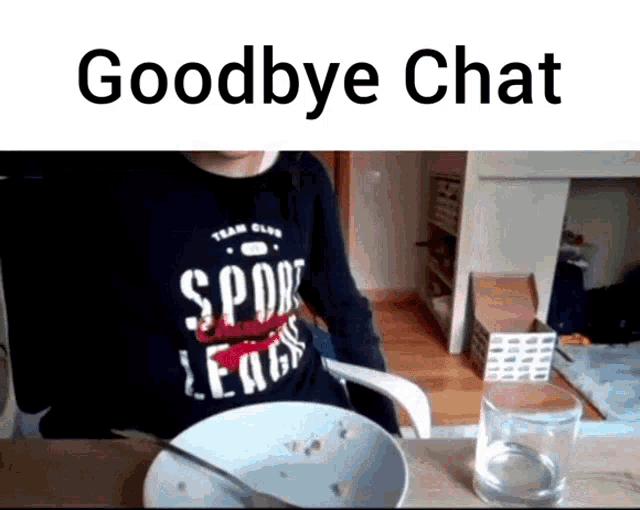 a person wearing a shirt that says spor league is sitting at a table with a bowl of cereal