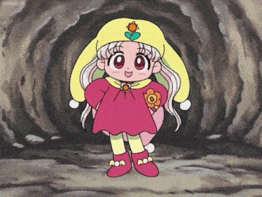 a little girl in a pink and yellow outfit with a flower on her hat