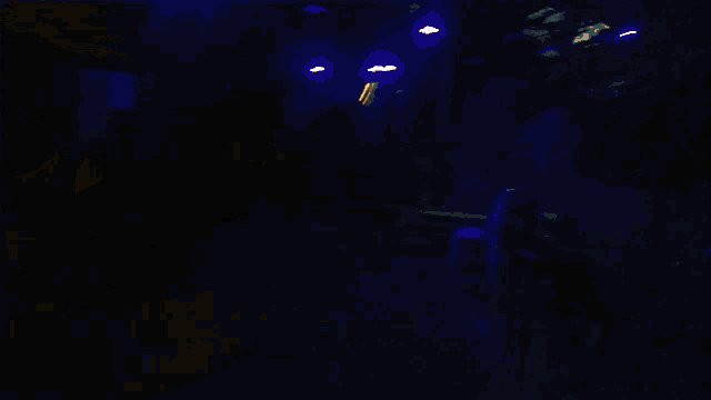 a blurry picture of a person 's face with a yellow light behind them