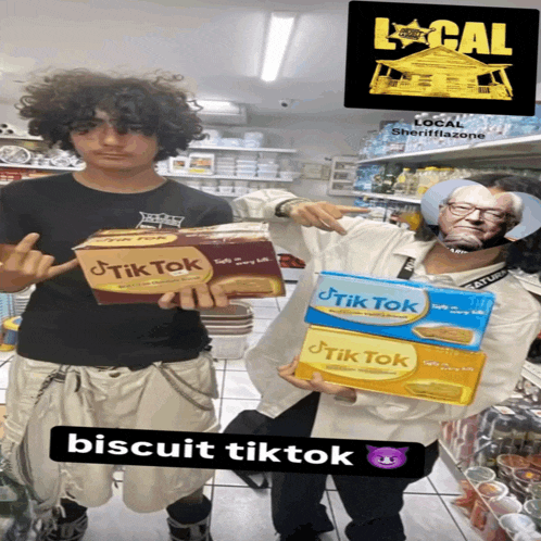 two people holding up boxes of tik tok biscuits in a store