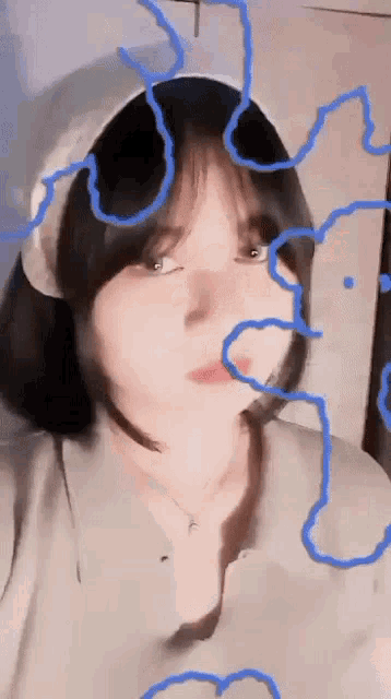 a girl wearing a headband with blue lines coming out of it