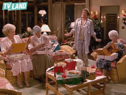 a group of older women sitting in a living room with a tv land logo