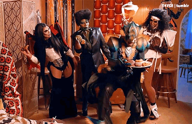 a group of people dressed in costumes are standing in a room with the words tumblr at the top