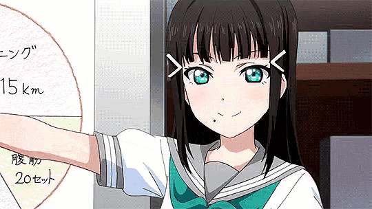 a girl with black hair and blue eyes is standing in front of a sign that says 15km