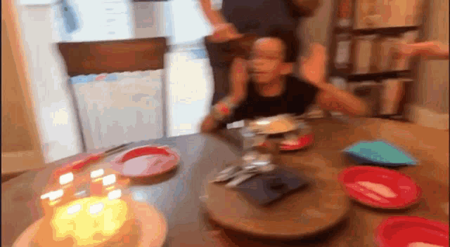 a birthday cake with candles on it is on a table