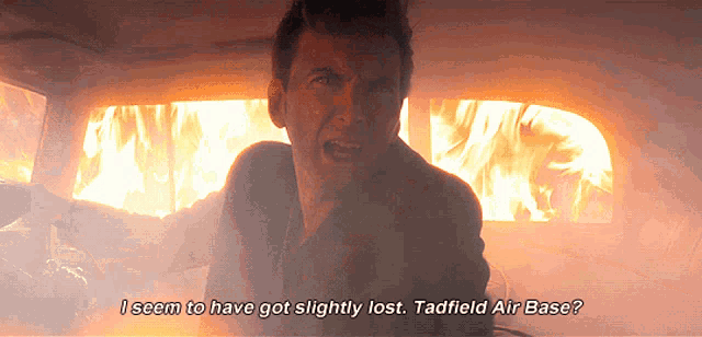 a man in front of a burning car says " i seem to have got slightly lost "