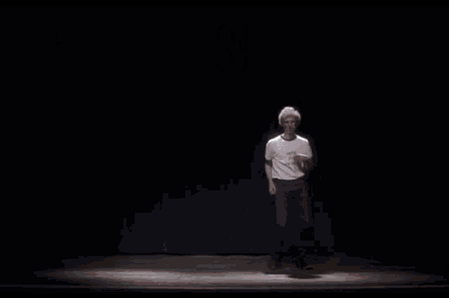 a man is dancing on a stage with the words c'est jeudi above him