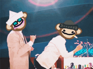 two monkeys are standing next to each other and one is wearing sunglasses