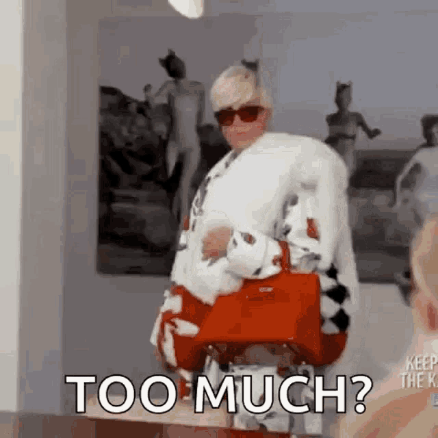 a woman in a fur coat is holding a red purse and says `` too much ? ''