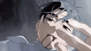 a close up of a person 's face with a glass in front of it .