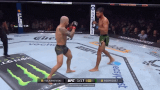 two men are fighting in a boxing ring with a monster energy drink advertisement