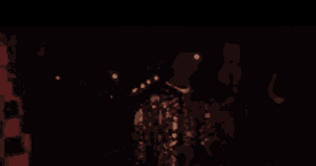 a close up of a person holding a candle in their hand