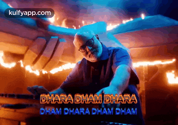 a man is playing a keyboard in front of a fire and the words bharat ham bharat