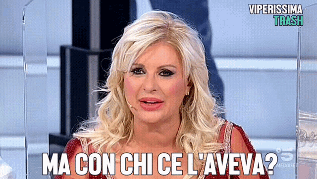 a woman in a red dress says ma con chi ce l' aveva