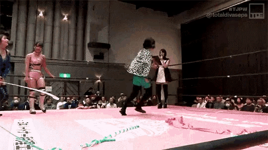 a woman in a wrestling ring with the hashtag #tjpw on the bottom